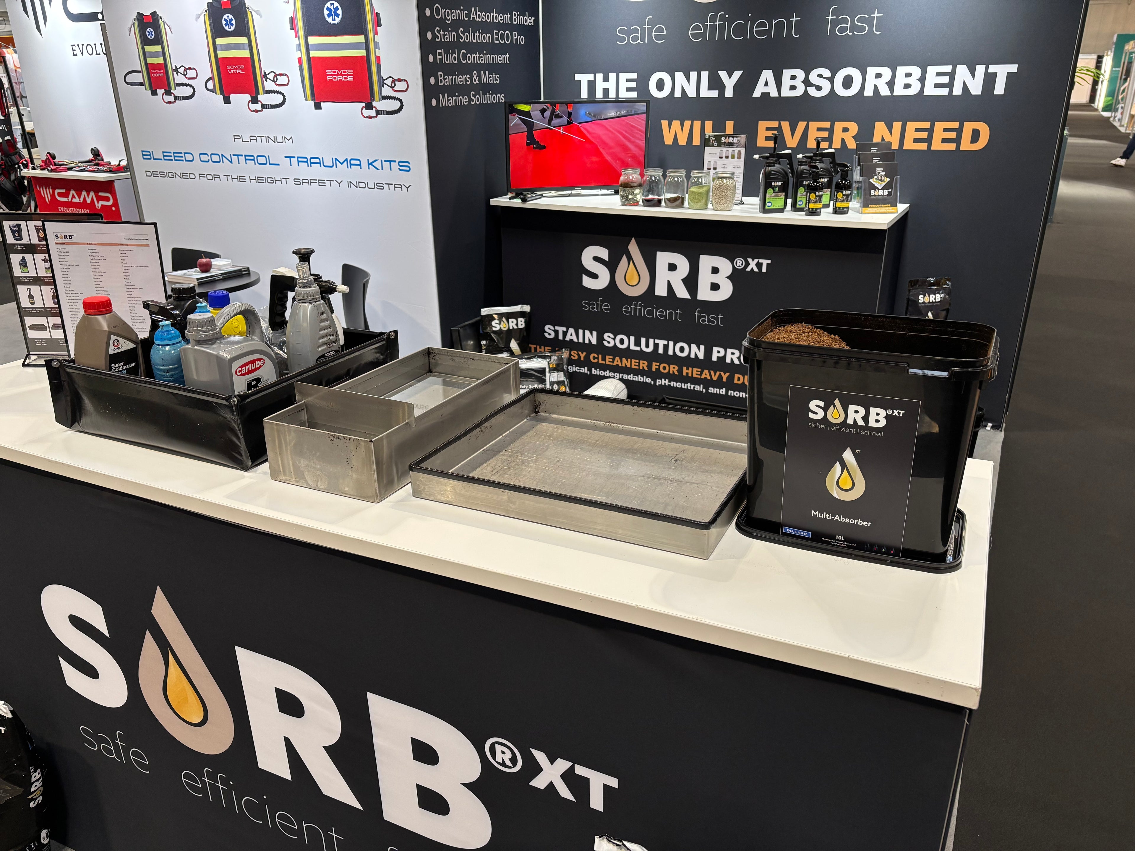 SORB XT display at an exhibition with various products and branding.